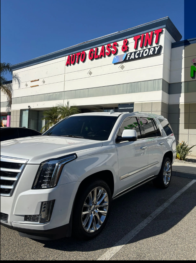 White Cadillac Escalade with tinted windows
