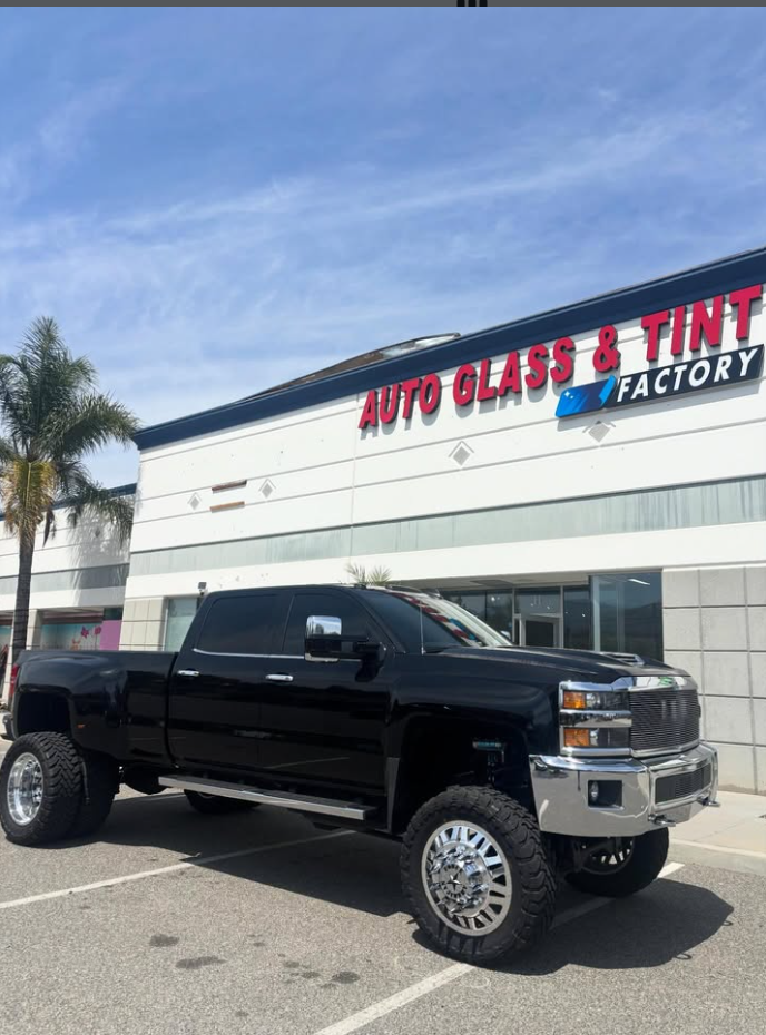 Lifted black Chevy Silverado dually